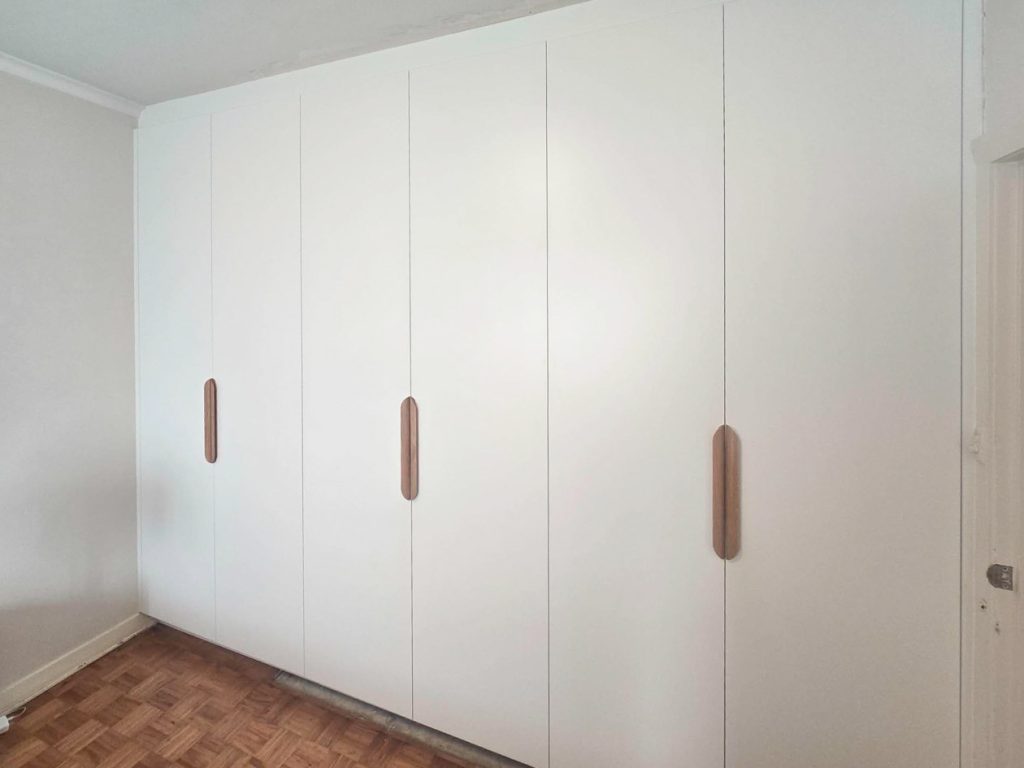 Custom built-in wardrobe with sliding doors