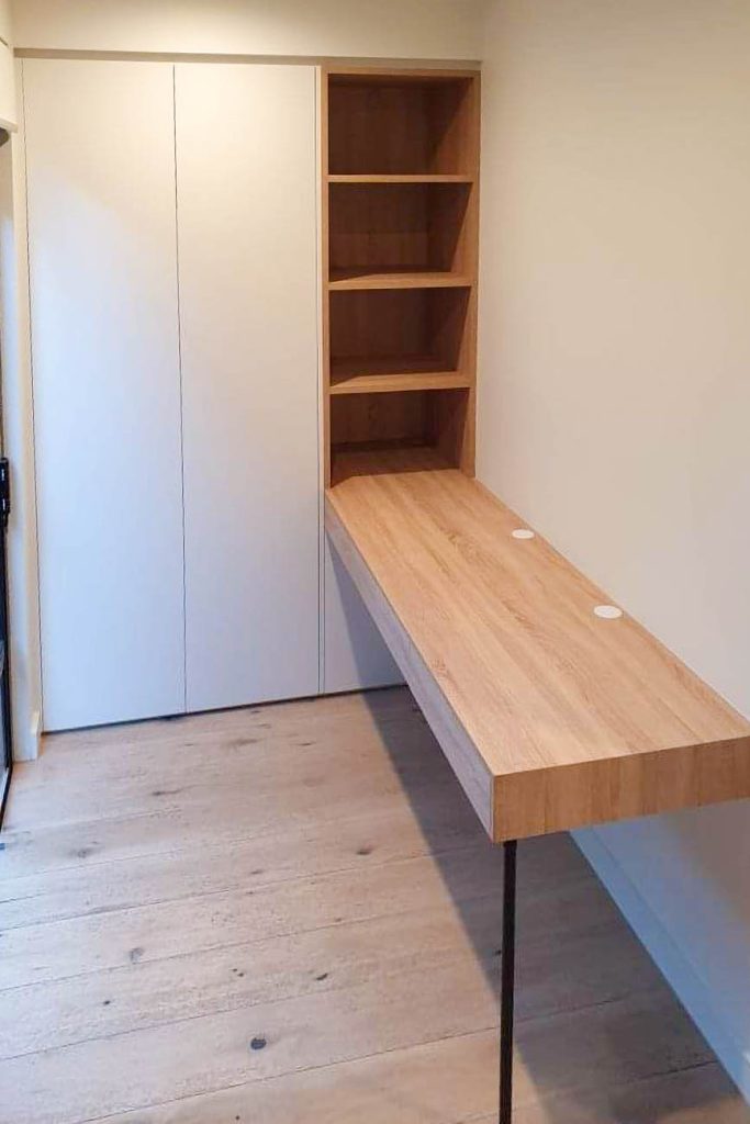 Custom home office with built-in desk and shelving