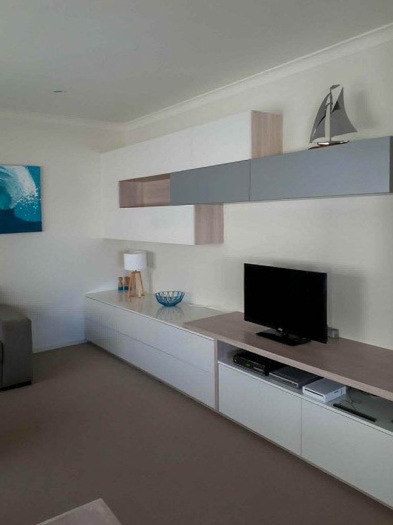 Custom TV entertainment unit with concealed storage