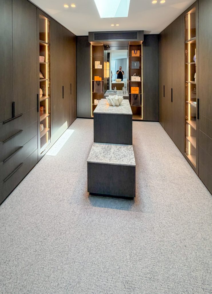 Custom dressing room with full-height hanging and shoe storage